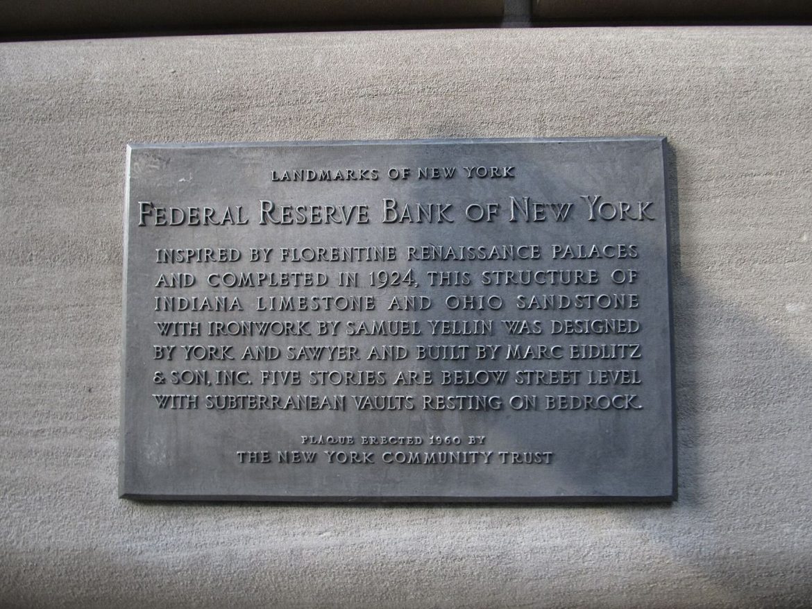 Stacks of gold bars in a vault